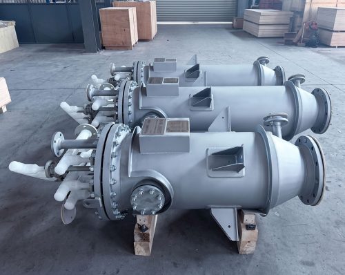 Three horizontal FUNDABAC® candle filter vessels with white plastic nozzle piping, assembled in the workshop before shipment