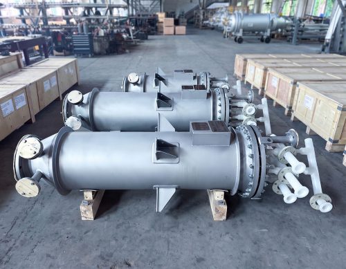 Side view of the FUNDABAC® candle filter vessels supplied for API decolorization, with all-plastic connection piping and export crates alongside